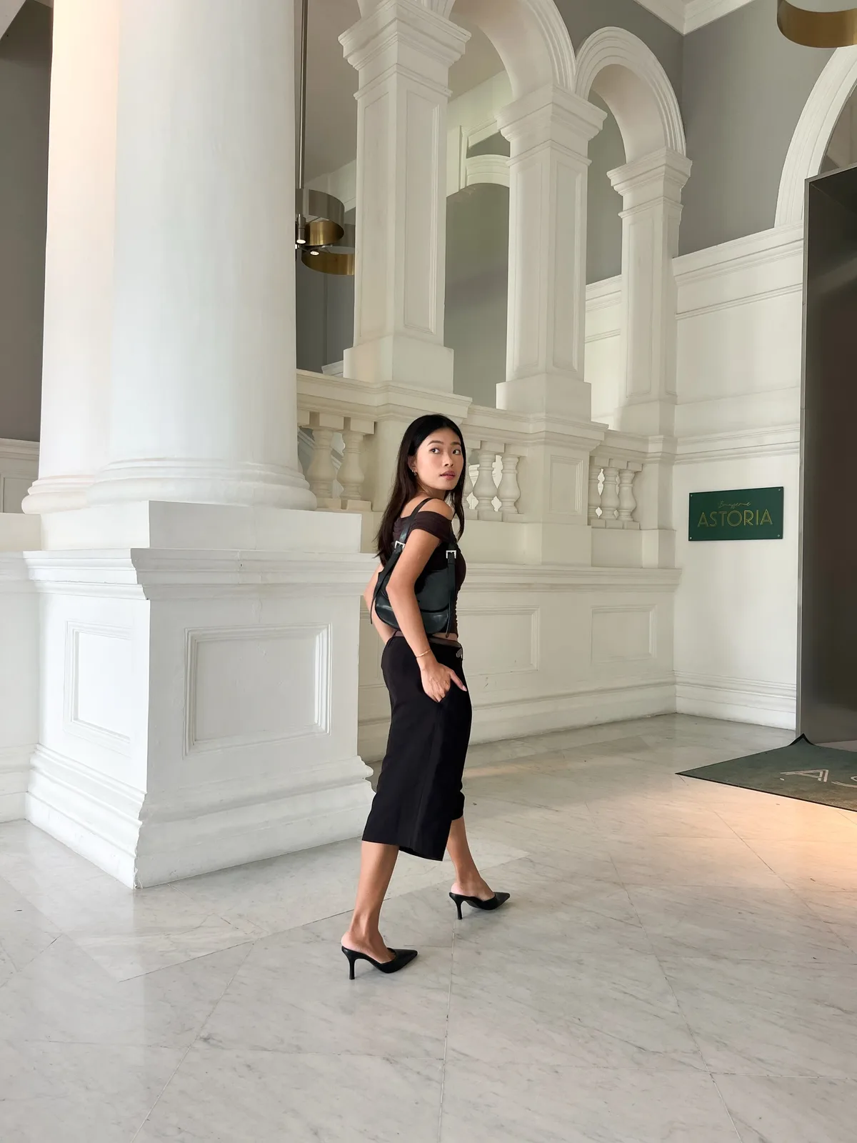 Customer styling a black layered vintage outfit
