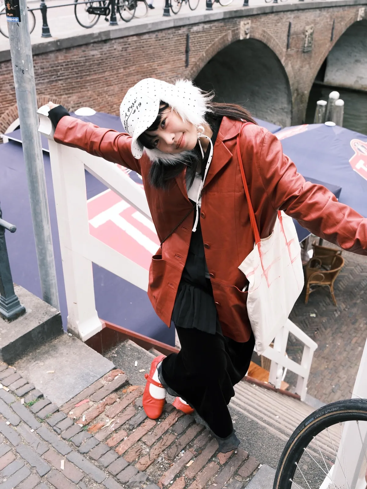Customer styling a rust vintage jacket outdoors
