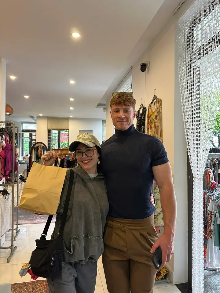Customers smiling with their Yen May Vintage shopping bags