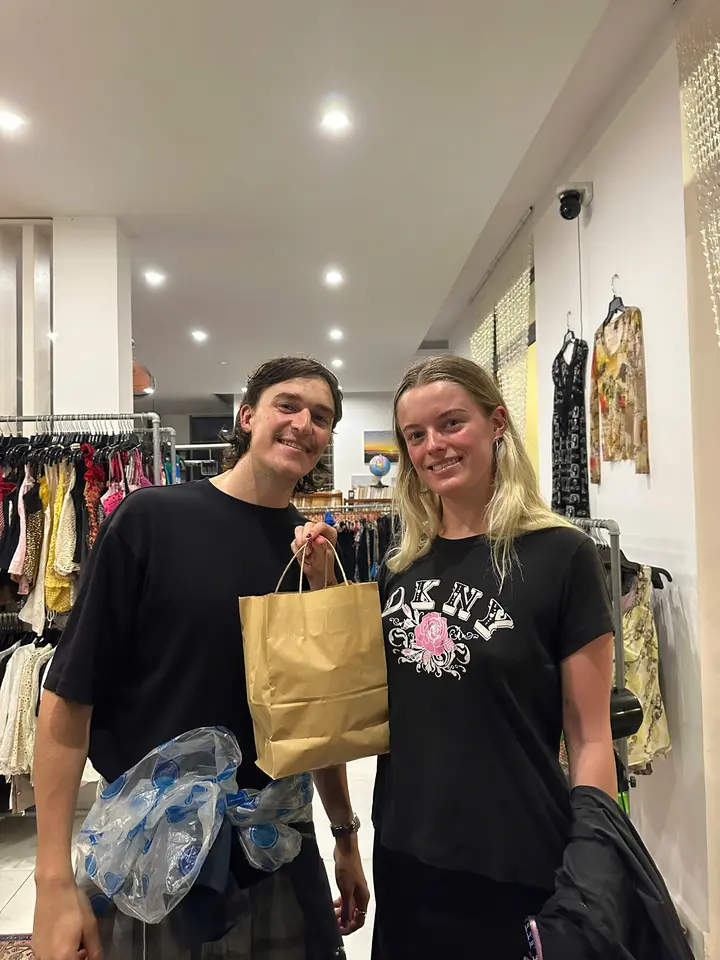 Happy customer with a Yen May Vintage shopping bag