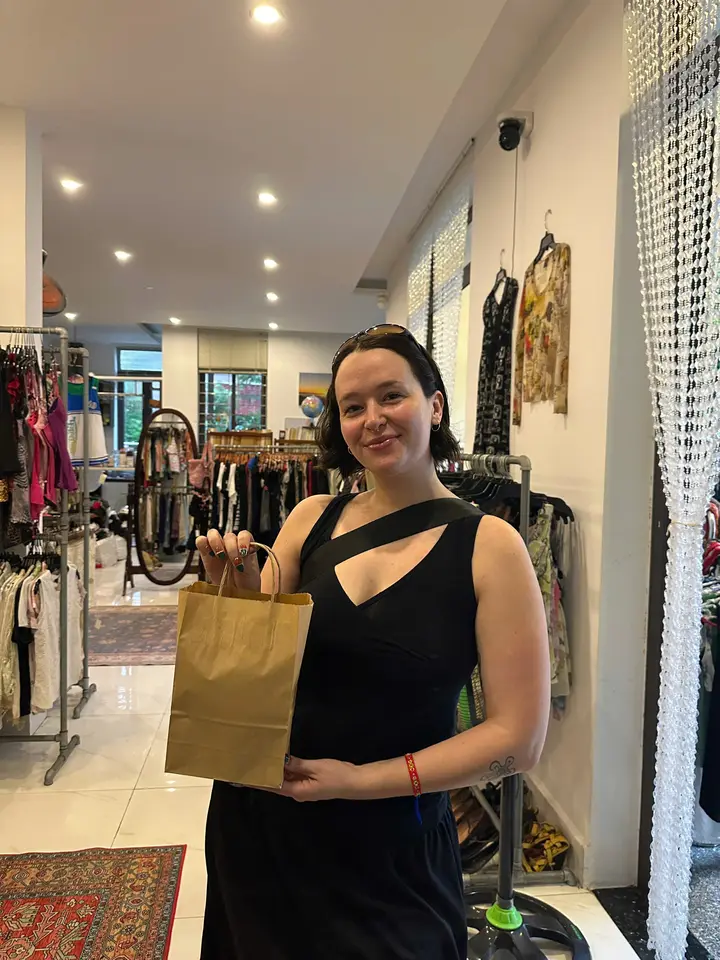 Customer leaving Yen May Vintage with a chosen piece